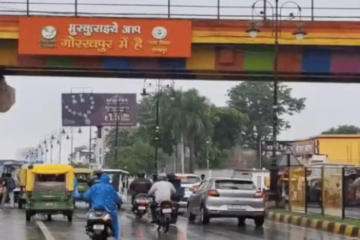 Gorakhpur rain update with schools closed and people using umbrellas on roads
