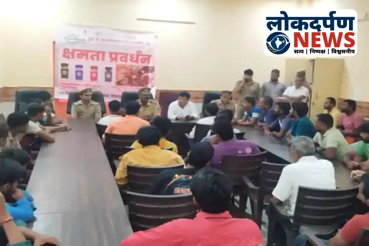Police and officials discussing security arrangements for Durga Puja in Unwal